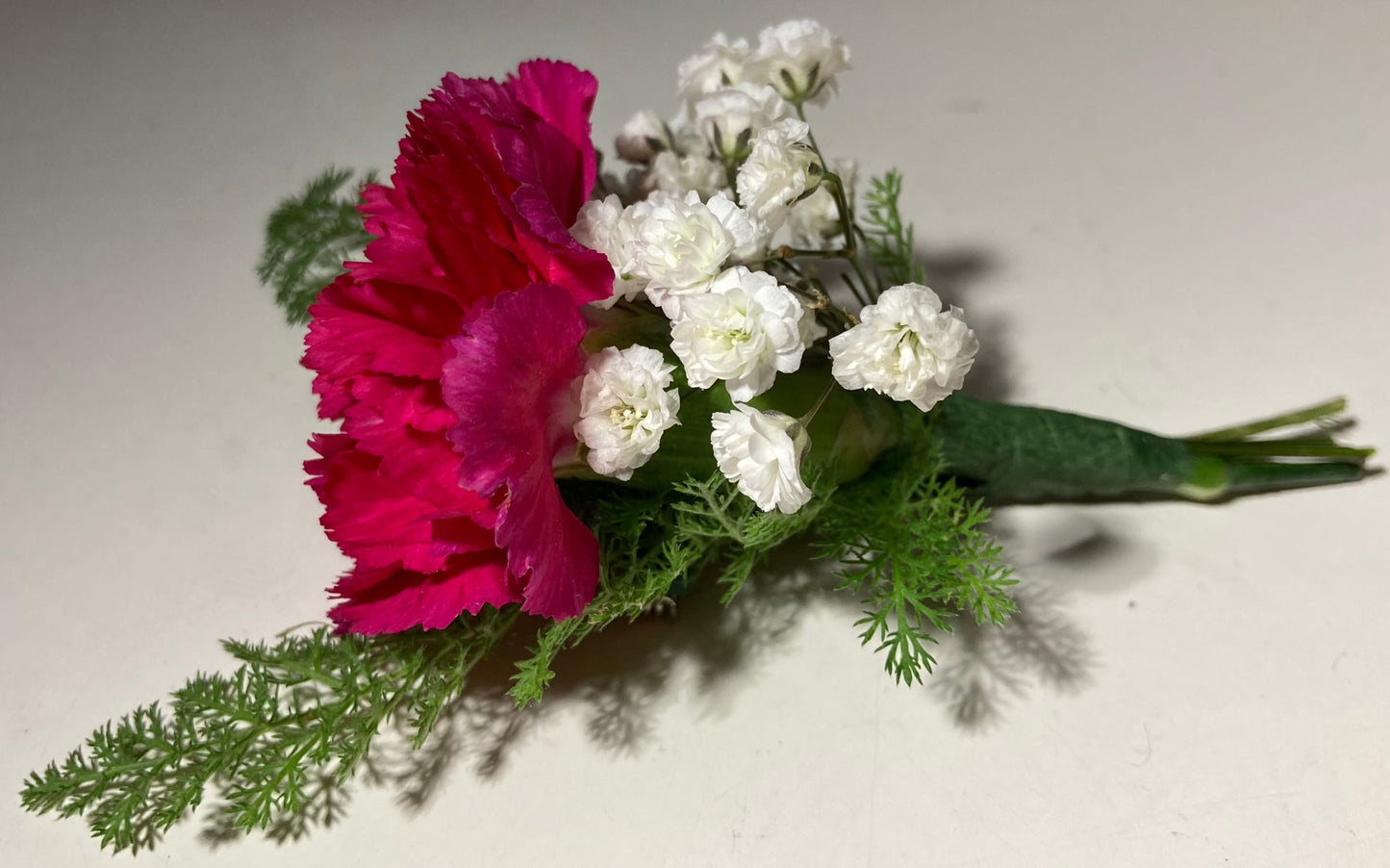 Tinsy button-hole arrangement