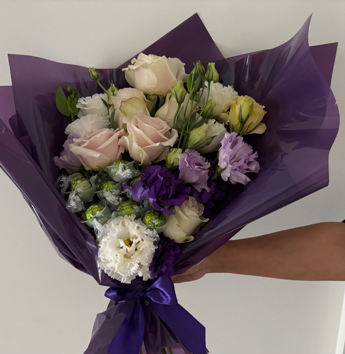 Fresh flower bouquet with chocolate
