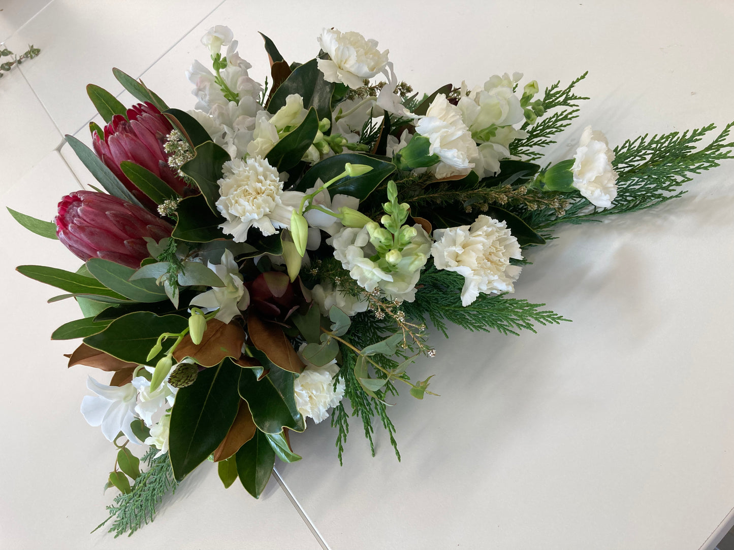 Tribute - tear drop flower arrangement