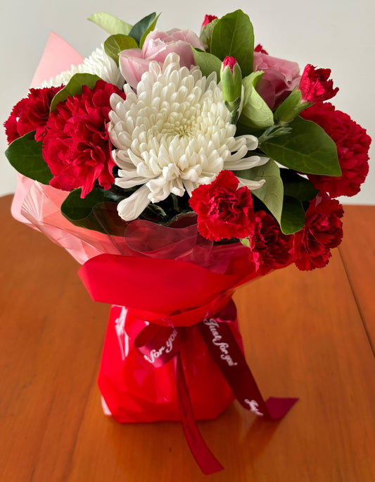 Bouquet of chrysanthemums, carnations and roses