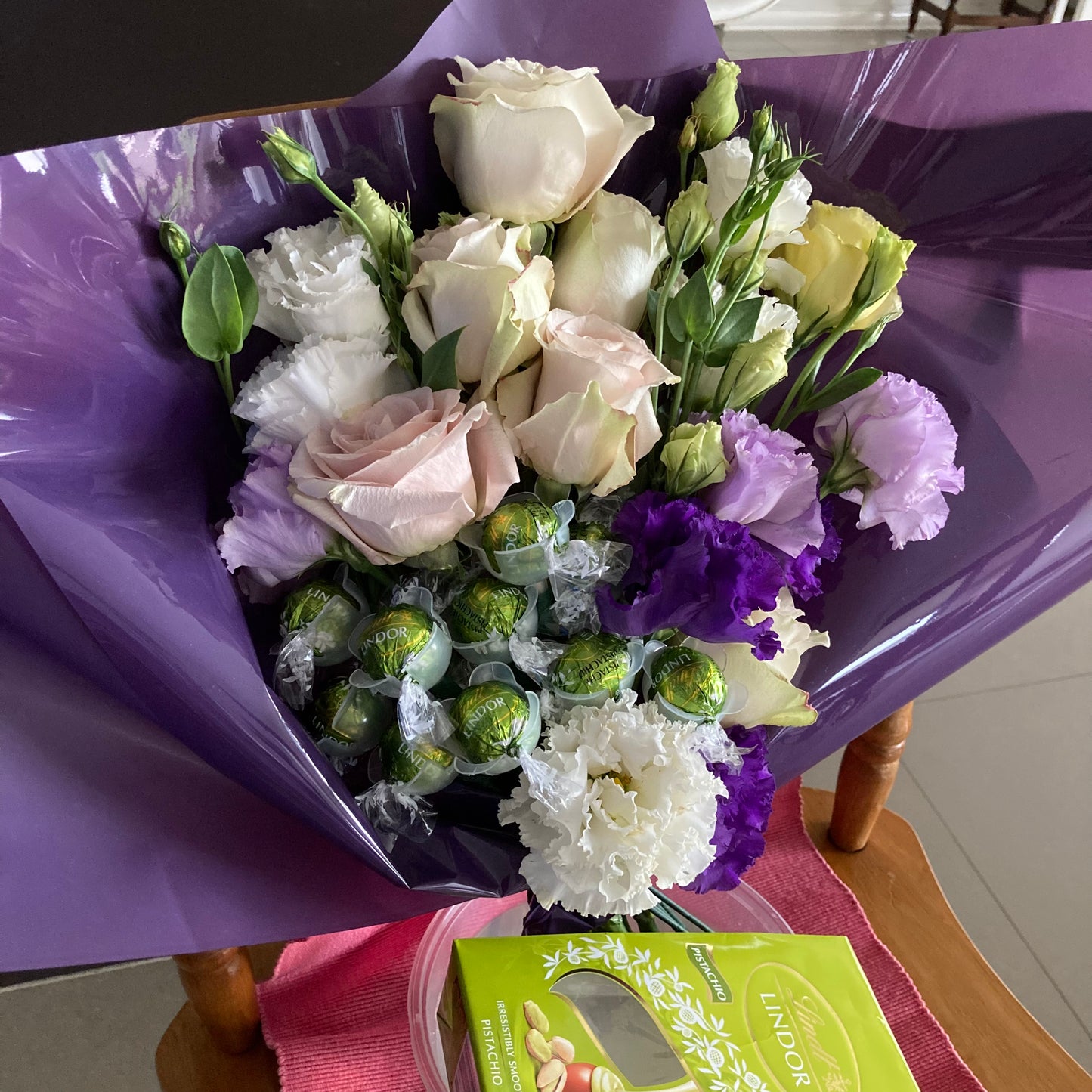 Fresh flower bouquet with chocolate